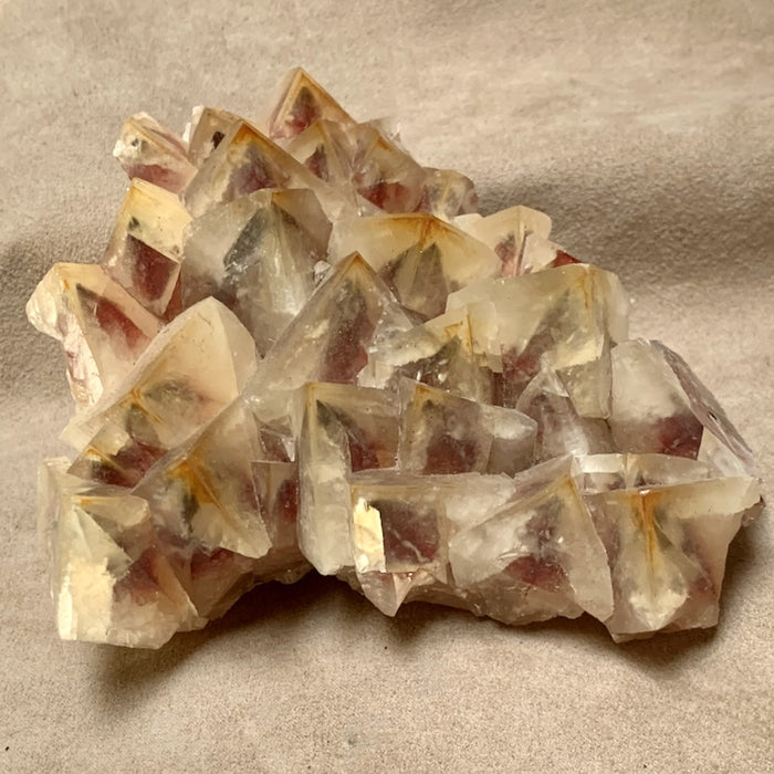 Calcite (Mariposa Dogtooth) with Hematite Phantoms (Mexico)